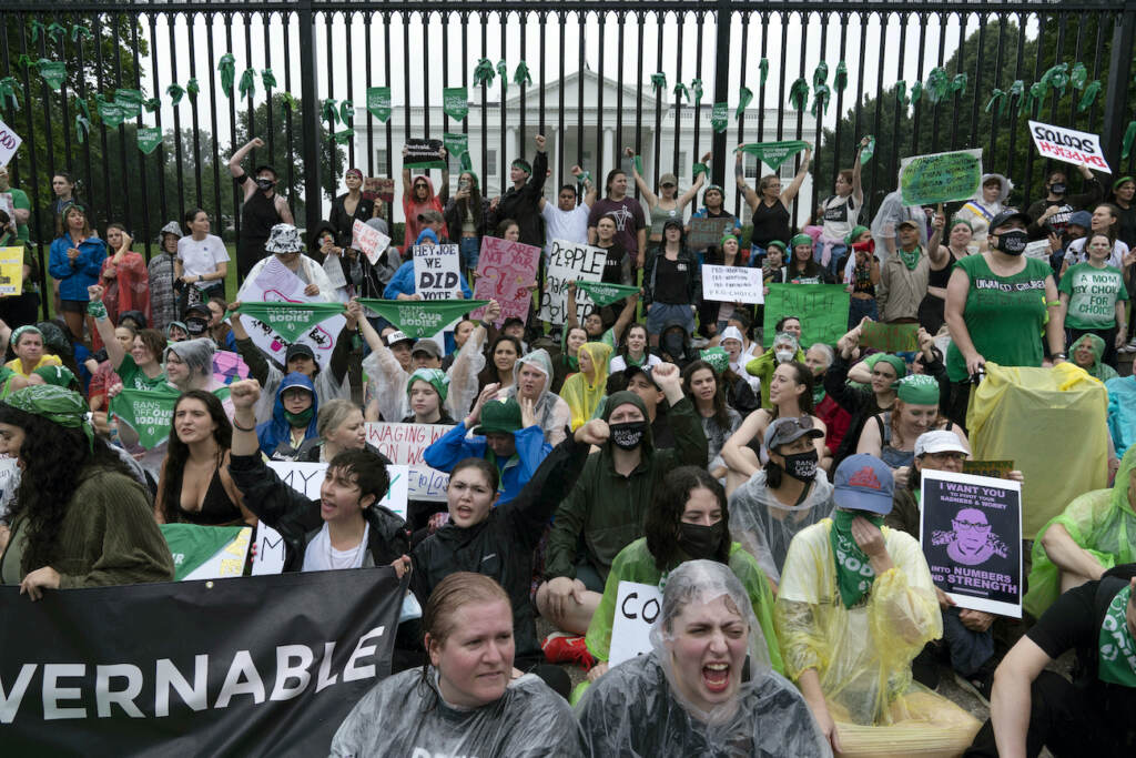 Supreme Court Abortion Abortion-rights demonstrators shout slogans after tying green flags to the fence of the White House during a protest to pressure the Biden administration to act and protect abortion rights, in Washington, Saturday, July 9, 2022. (AP Photo/Jose Luis Magana)