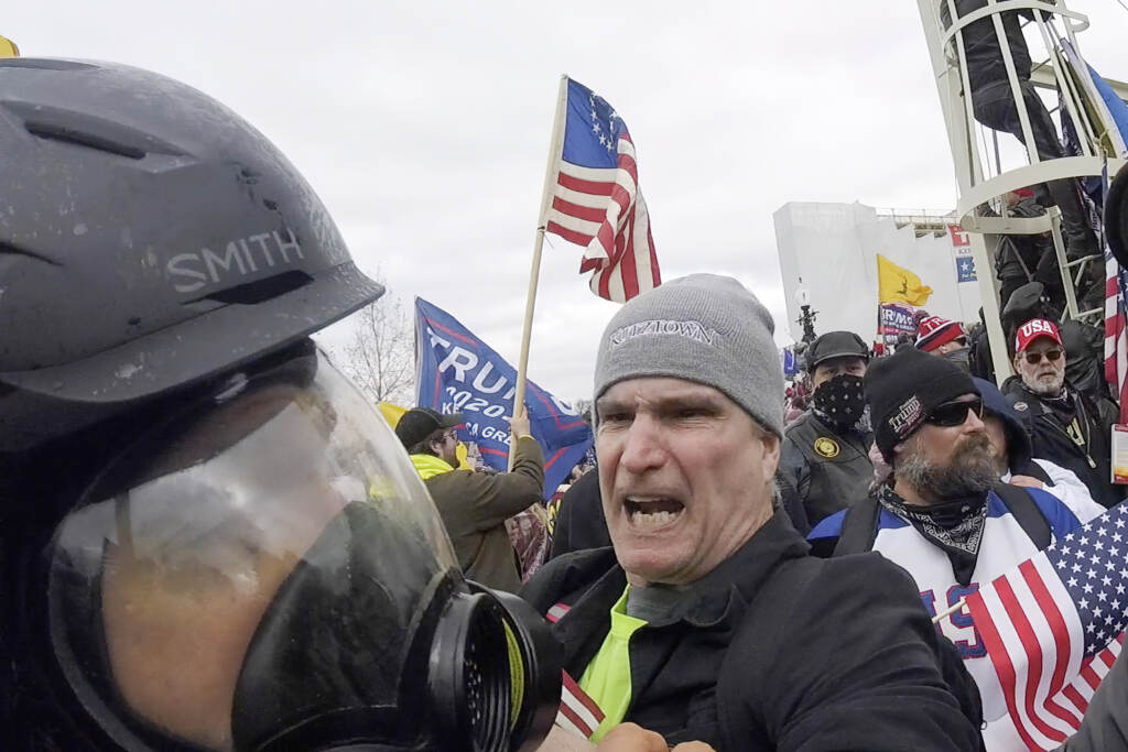 Capitol Riot Photographer Assaulted Alan William Byerly is seen attacking an Associated Press photographer during the insurrection at the U.S. Capitol