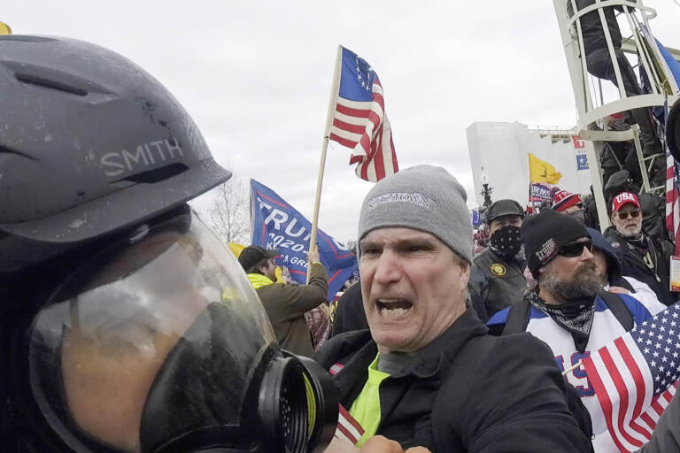 Alan William Byerly is seen attacking an Associated Press photographer during the insurrection at the U.S. Capitol