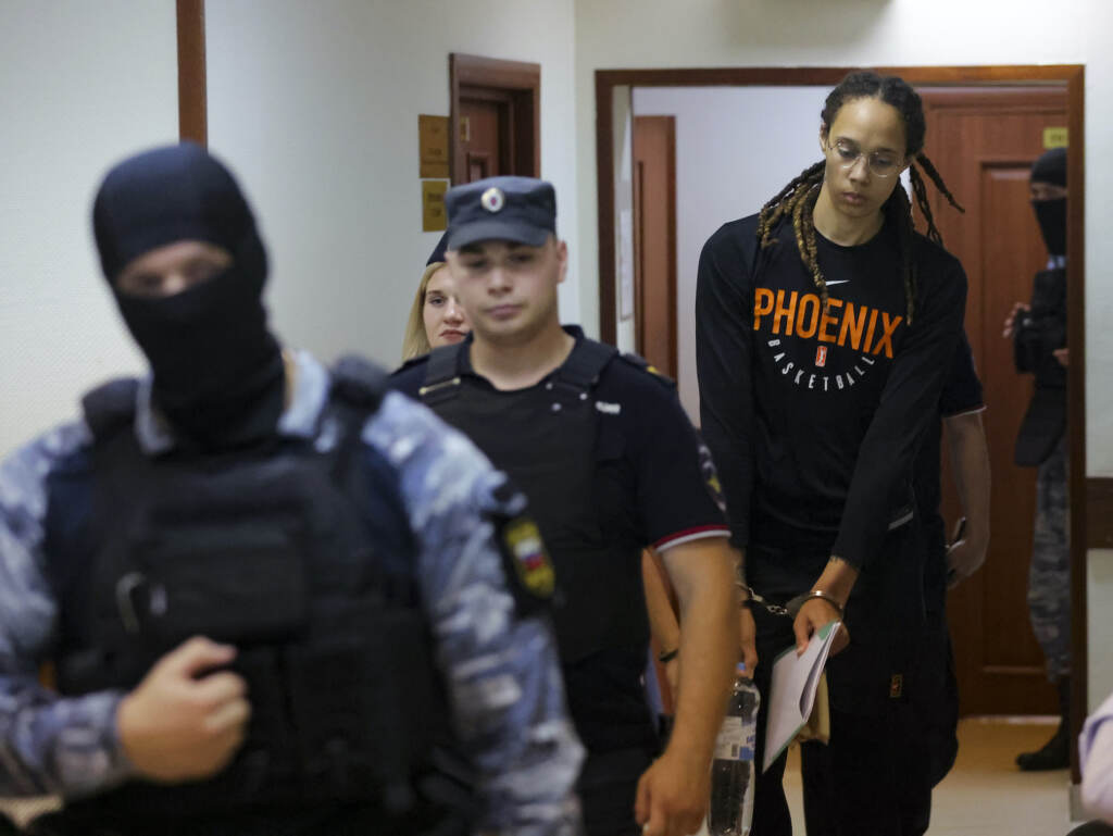 Russia Griner WNBA star and two-time Olympic gold medalist Brittney Griner is escorted to a courtroom for a hearing, in Khimki just outside Moscow, Russia, Wednesday, July 27, 2022. (Evgenia Novozhenina/Pool Photo via AP)
