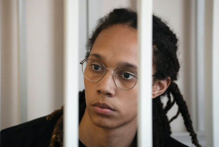WNBA star and two-time Olympic gold medalist Brittney Griner sits in a cage at a court room prior to a hearing, in Khimki just outside Moscow, Russia, Wednesday, July 27, 2022. (AP Photo/Alexander Zemlianichenko, Pool)