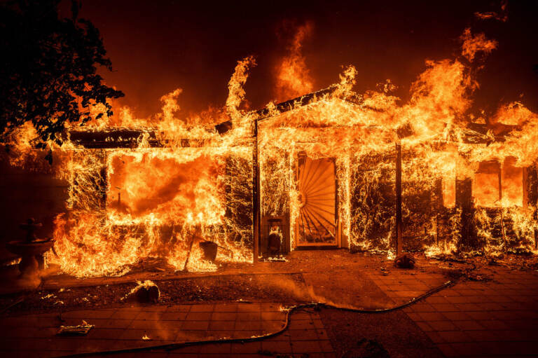 A house is in flames.