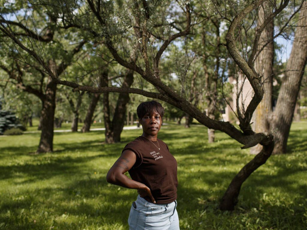 Brittany Mostiller, former executive director of the Chicago Abortion Fund, said the fund’s financial support prevented her from taking more drastic actions she’d considered when she found out she was pregnant. Brittany Mostiller poses for a portrait underneath a tree