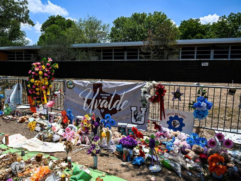 Mementos decorate a makeshift memorial to the victims of the mass shooting at Robb Elementary School in Uvalde, Texas. To protect students from active shooters and extreme weather, National Safety Shelters sells safety pods that can fit a classroom of students inside. (Chandan Khanna/AFP via Getty Images)