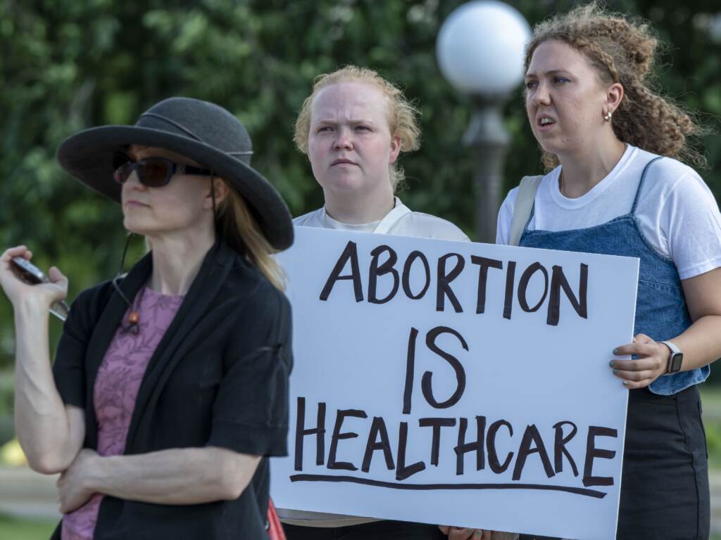 Supporters of abortion rights rally at the Minnesota State Capitol Building in downtown St. Paul following the U.S. Supreme Court ruling to overturn Roe v. Wade. A person holds a sign that says, ''Abortion is health care'' at a rally at the Minnesota State Capitol