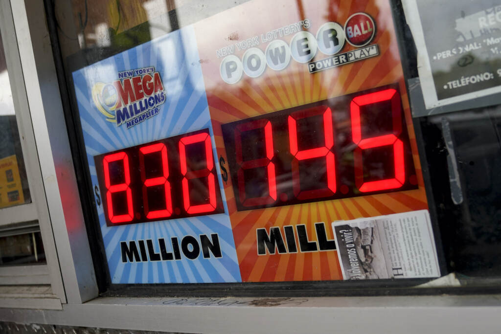 Lottery Jackpot The Mega Millions lottery jackpot is advertised outside a smoke shop