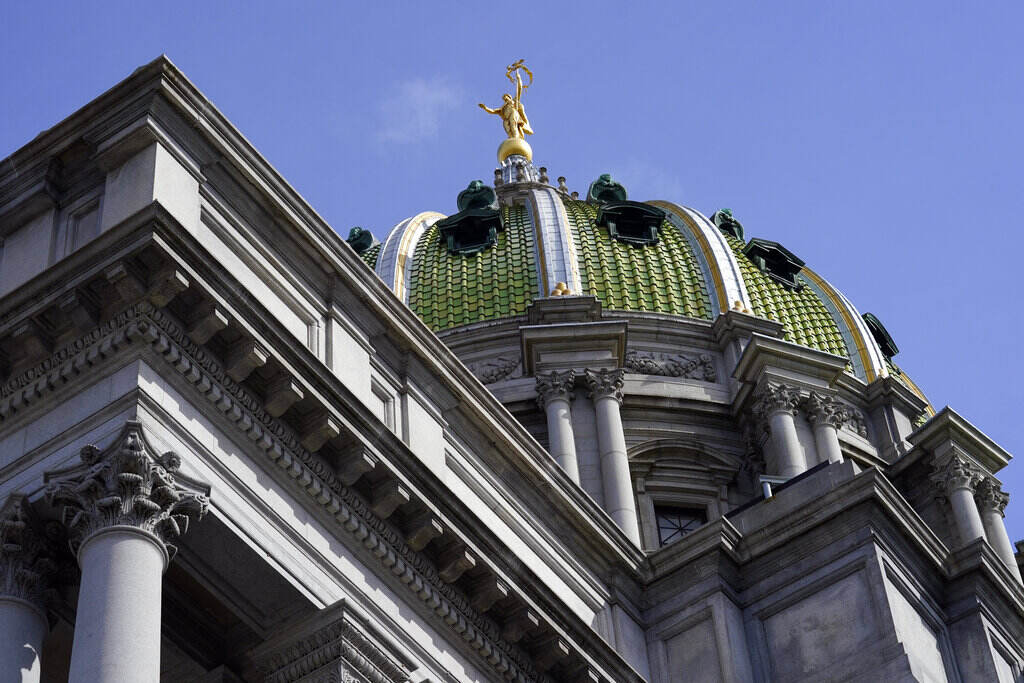Pennsylvania Budget A view from below of the dome of the State Capitol building in Harrisburg, Pa., with blue sky in the background.