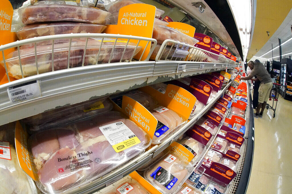 Justice Department Poultry Processors Packaged chicken is on display at a grocery store.