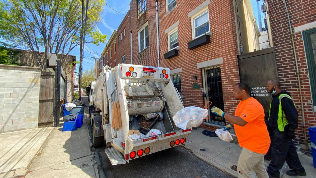 recyclingtrash-sanitationworkers-01crop Streets Department workers pick up residents' trash