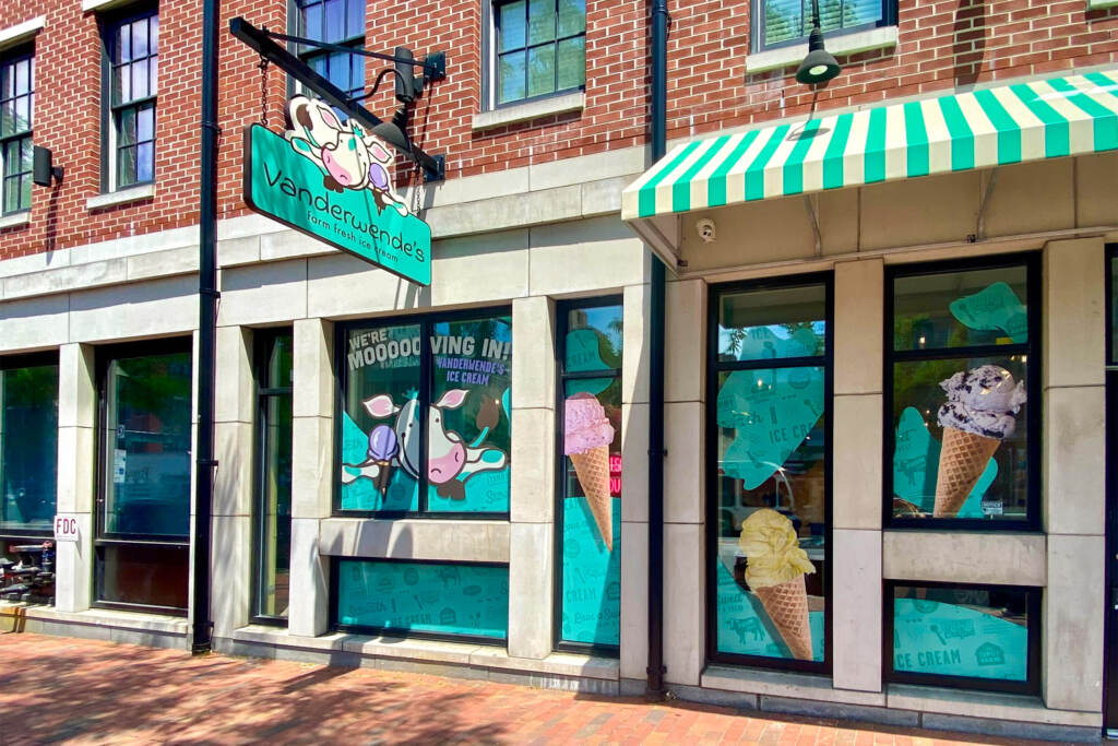 vanderwendes-icecream-03 A green-and-white sign and awning, and pictures of ice cream cones, adorn the outside of a new ice cream shop.