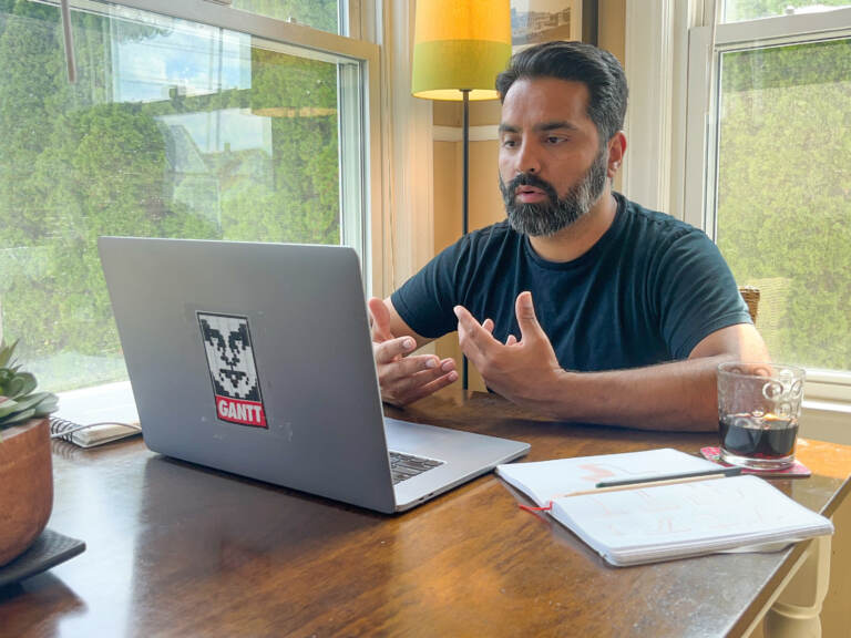 Nitin Budhiraja is seen facing his computer during a Zoom meeting