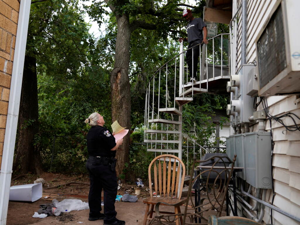 An Oklahoma County deputy serves a renter with a court summons notifying him of an eviction order in Oklahoma City, Okla., on Sept. 15, 2021. An Oklahoma County deputy serves a renter with a court summons notifying him of an eviction order in Oklahoma City, Okla., on Sept. 15, 2021. (Nick Oxford/REUTERS)