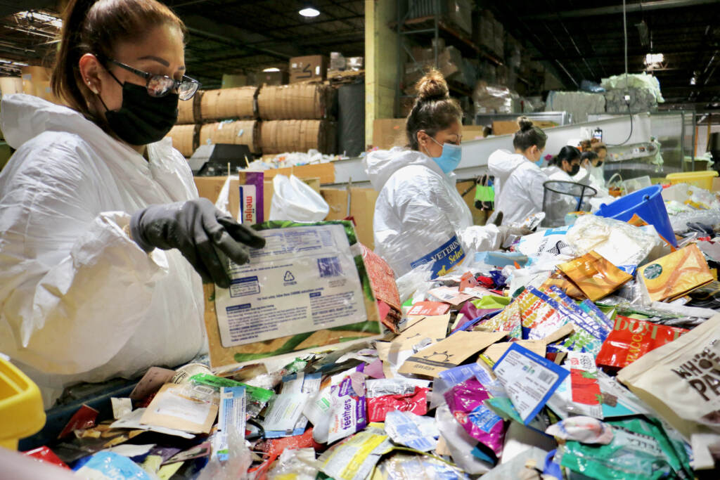 2022 05 19-e lee-new brunswick nj-terracycle sorting low view Workers sort items that require different recycling processes at a TerraCycle facility in New Brunswick. (Emma Lee/WHYY)