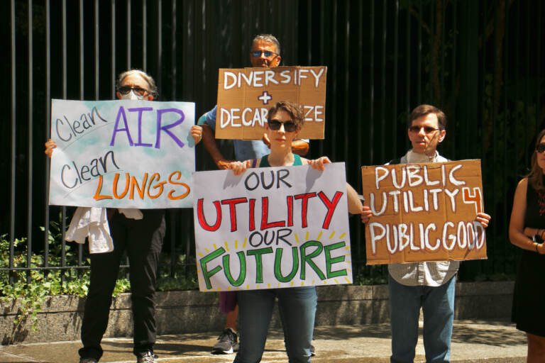 Protesters gather outside 1515 Arch Street in Center City to demand a reduction in greenhouse gas emissions. The protest targeted Philadelphia Gas Works, whose budget is up for review. (Emma Lee/WHYY)