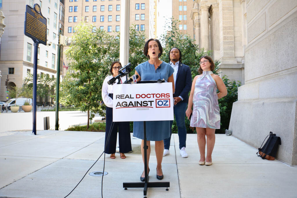 2022 08 10-e lee-val arkoosh-philadelphia city hall-real doctors against oz Dr. Val Arkoosh,(left), Chair of Montgomery County Board of Commissioners, speaks outside Philadelphia City Hall, where she helped launch the Real Doctors Against Oz campaign. The campaign is directed against Republican Senate candidate Mehmet Oz and is financed by his opponent, Democratic Lieutenant Gov. John Fetterman. (Emma Lee/WHYY)
