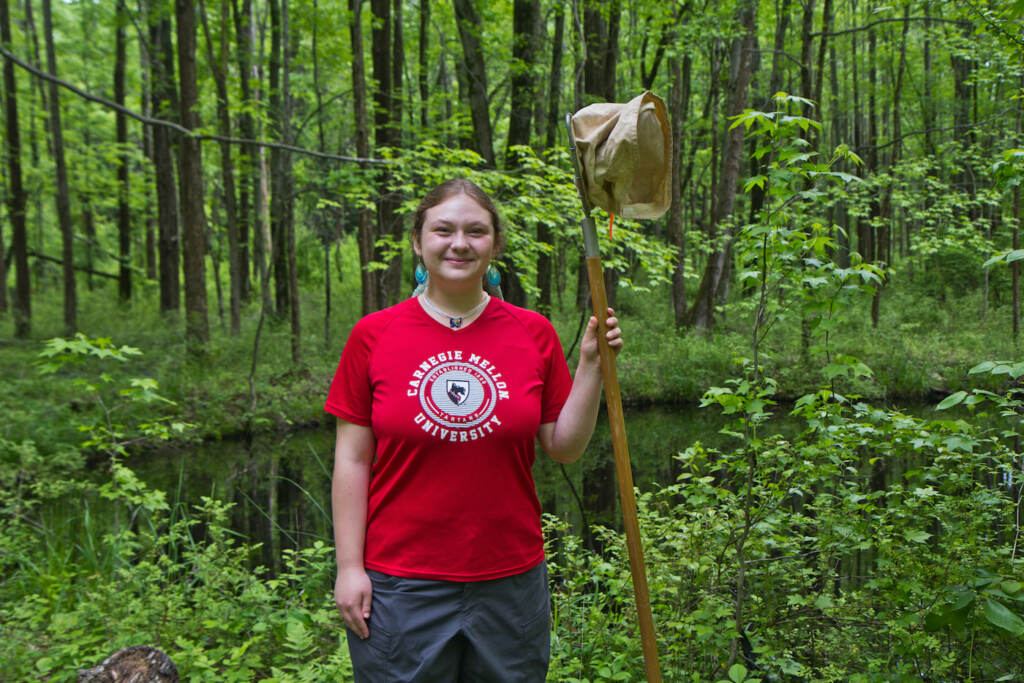 2022 08 17 k paynter Sonja Michaluk wetlands action (1 of 1)-2 Sonja Michaluk evaluates water quality in the wetlands around Princeton, N.J., by looking at the inverabtrate life found in water samples. (Kimberly Paynter/WHYY)