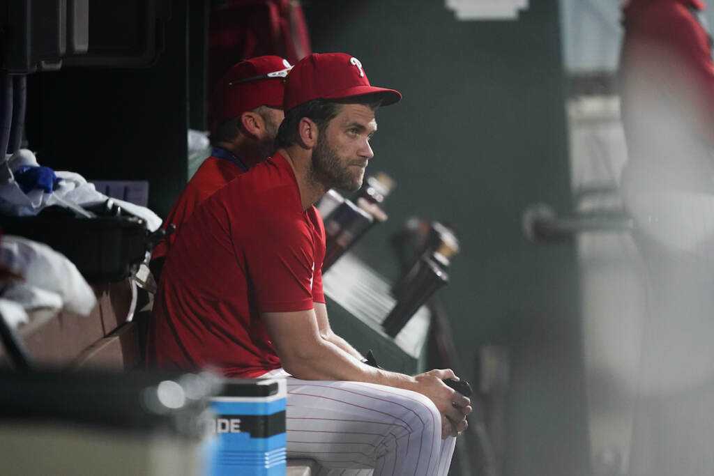 Bryce Harper File photo: Philadelphia Phillies Bryce Harper sits in the dugout during the eighth inning of a baseball game against the Chicago Cubs, Saturday, July 23, 2022, in Philadelphia. (AP Photo/Matt Rourke)