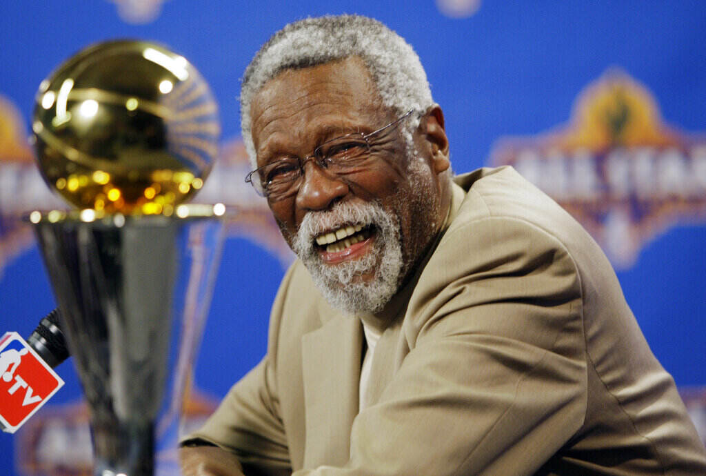 Obit-Bill Russell Basketball NBA great Bill Russell reacts at a news conference as he learns the most valuable player award for the NBA basketball championships has been renamed the Bill Russell NBA Finals Most Valuable Player Award, Feb. 14, 2009, in Phoenix. Russell has died at age 88. (AP Photo/Matt York)