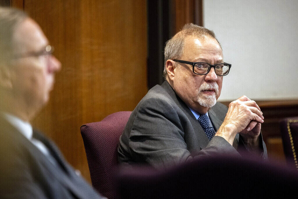 Greg McMichael File photo: Greg McMichael looks at the gallery during the testimony of his son, Travis McMichael, in the trial of himself, his son and William