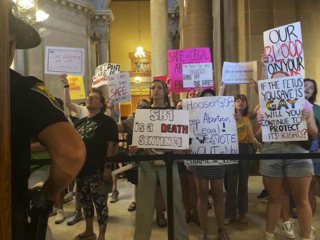 Abortion Indiana Abortion-rights protesters fill Indiana Statehouse corridors and cheer outside legislative chambers, Friday, Aug. 5, 2022, as lawmakers vote to concur on a near-total abortion ban, in Indianapolis. (AP Photo/Arleigh Rodgers)