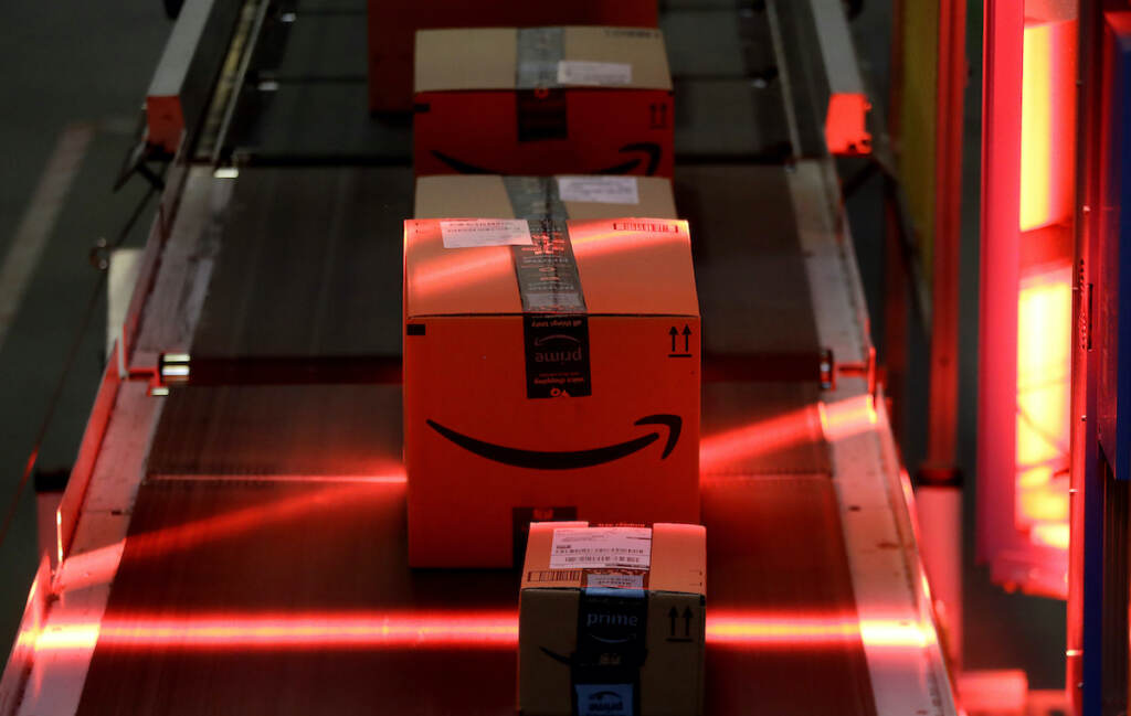 Amazon Worker Deaths File photo: Packages riding on a belt are scanned to be loaded onto delivery trucks at the Amazon Fulfillment center. (AP Photo/Julio Cortez, File)