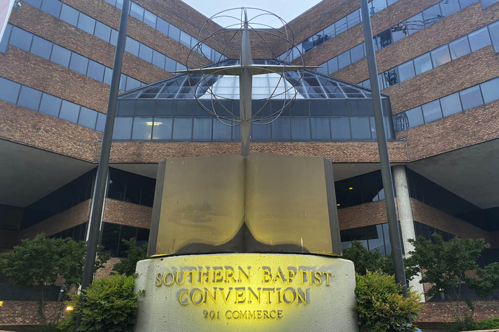 Southern Baptists Investigation File photo: A cross and Bible sculpture stand outside the Southern Baptist Convention headquarters in Nashville, Tenn., on May 24, 2022. The Executive Committee of the Southern Baptist Convention said Friday, Aug. 12, 2022, that several of the denomination's major entities are under investigation by the U.S. Department of Justice. (AP Photo/Holly Meyer, File)