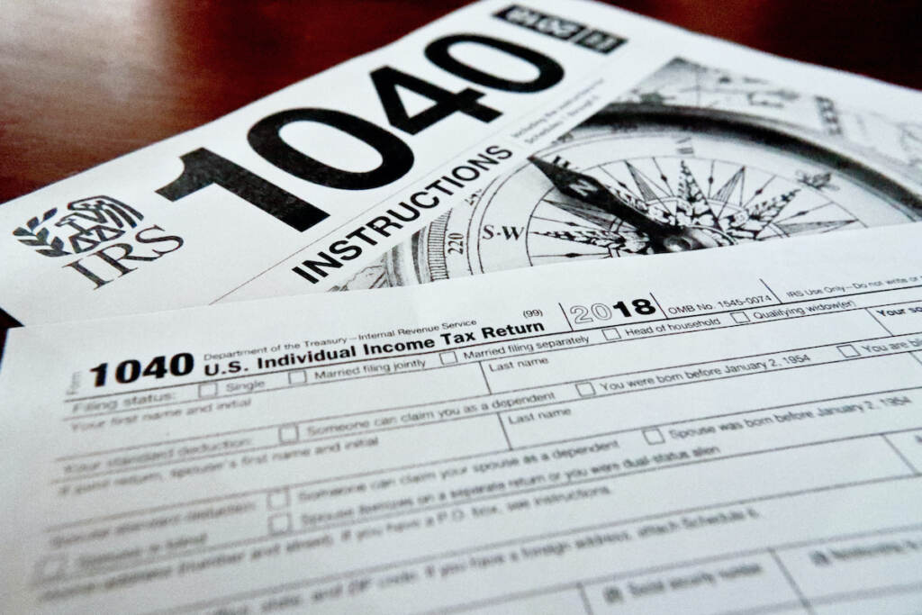 1040 and instructions File photo: Internal Revenue Service taxes forms are seen on Feb. 13, 2019. (AP Photo/Keith Srakocic, File)