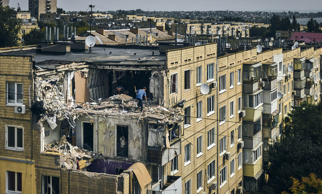 APTOPIX Russia Ukraine War A man cleans an apartment destroyed after Russian shelling in Nikopol, Ukraine, Monday, Aug. 15, 2022. (AP Photo/Kostiantyn Liberov)