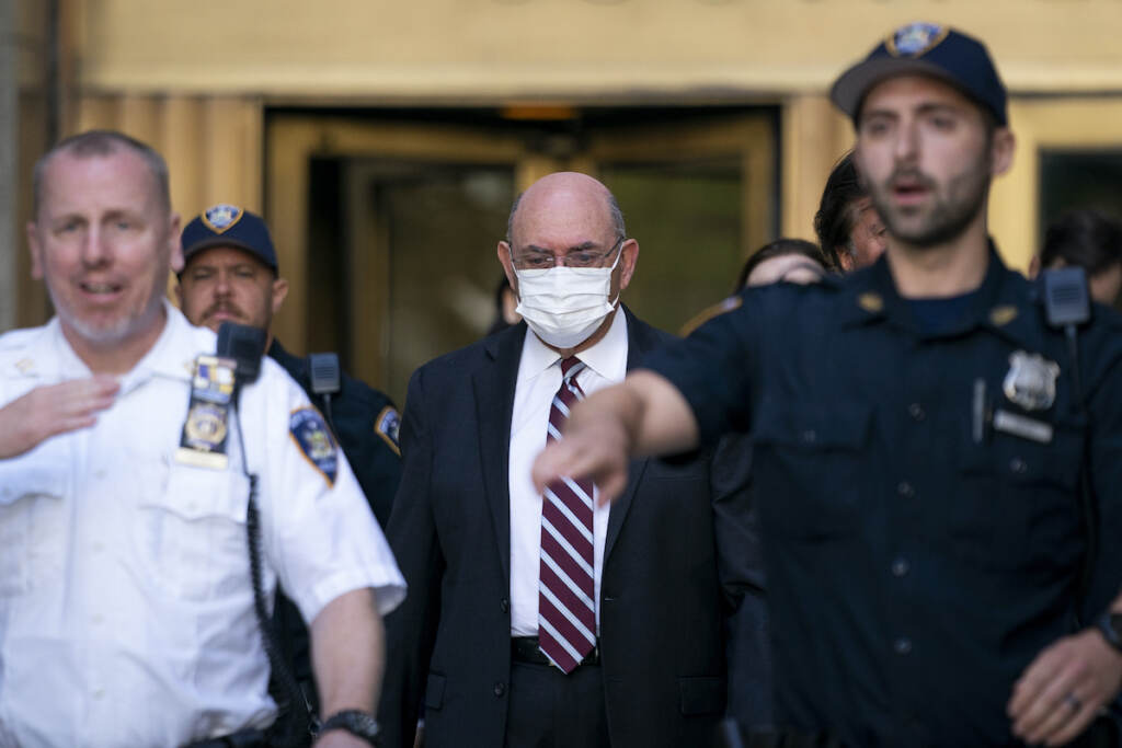 Trump Legal Troubles Weisselberg File photo: Law enforcement personnel escort the Trump Organization's former Chief Financial Officer Allen Weisselberg, center, as he departs court, Friday, Aug. 12, 2022, in New York. (AP Photo/John Minchillo, File)