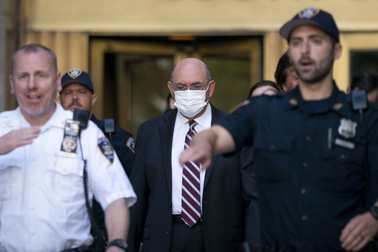 File photo: Law enforcement personnel escort the Trump Organization's former Chief Financial Officer Allen Weisselberg, center, as he departs court, Friday, Aug. 12, 2022, in New York. (AP Photo/John Minchillo, File)
