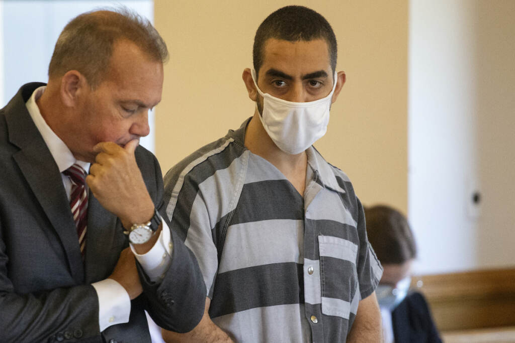 APTOPIX Salman Rushdie Assault Defense attorney Nathaniel Barone, left, and Hadi Matar, 24, right, listen during an arraignment in the Chautauqua County Courthouse in Mayville, NY., Thursday, Aug. 18, 2022. Matar was arrested Aug. 12 after he rushed the stage at the Chautauqua Institution and stabbed Salman Rushdie in front of a horrified crowd. (AP Photo/Joshua Bessex)