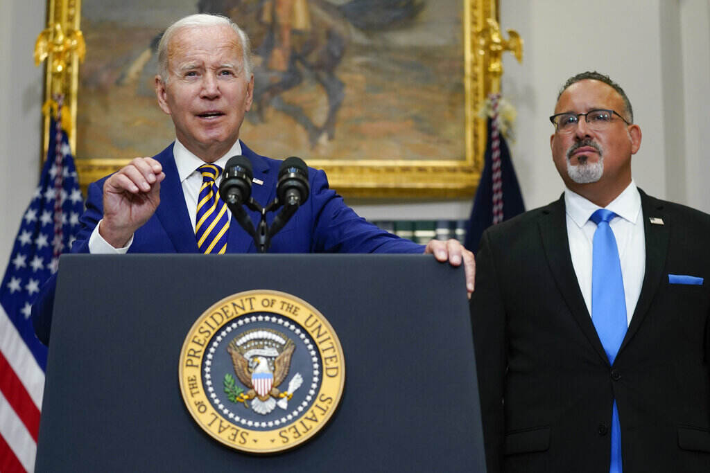 Biden Student Loans President Joe Biden speaks about student loan debt forgiveness in the Roosevelt Room of the White House, Wednesday, Aug. 24, 2022, in Washington. Education Secretary Miguel Cardona listens at right. (AP Photo/Evan Vucci)
