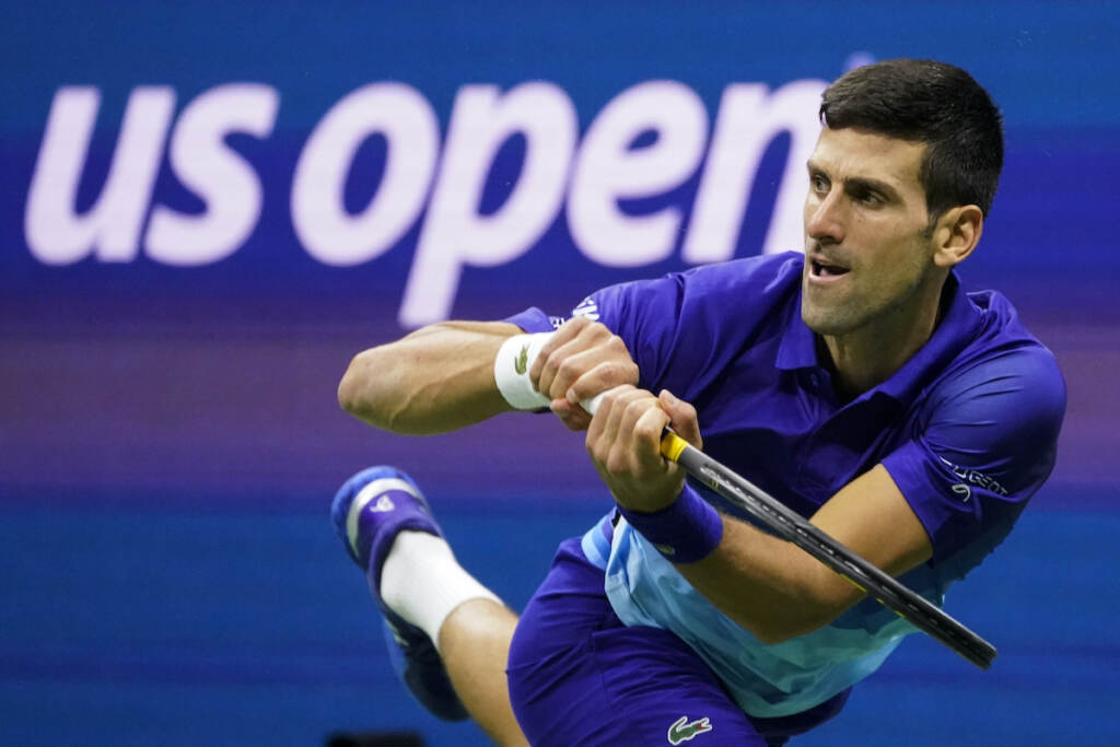 US Open Djokovic Out Tennis File photo: Novak Djokovic, of Serbia, returns a shot to Alexander Zverev, of Germany, during the semifinals of the U.S. Open tennis championships, Friday, Sept. 10, 2021, in New York. Djokovic will not play in the U.S. Open, as expected, because he is not vaccinated against COVID-19 and thus is not allowed to travel to the United States. Djokovic announced his withdrawal from the year’s last Grand Slam tournament on Twitter on Thursday, Aug. 25, 2022, hours before the draw for the event was revealed. (AP Photo/John Minchillo, File)
