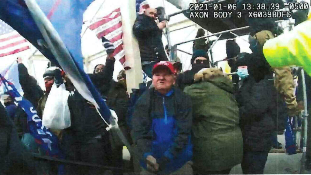 Capitol Riot Pennsylvania This image from police-worn body cam video and contained in the statement of facts supporting the arrest warrant for Howard Richardson, shows Richardson swinging a metal flagpole on Jan. 6, 2021, at the U.S. Capitol in Washington. (Department of Justice via AP)