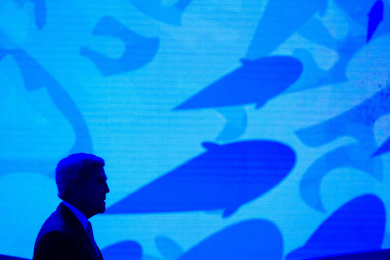 File photo: Secretary of State John Kerry stands onstage against a video backdrop of ocean life during the Our Ocean, One Future conference at the State Department in Washington, Thursday, Sept. 15, 2016. (AP Photo/Cliff Owen, File)
