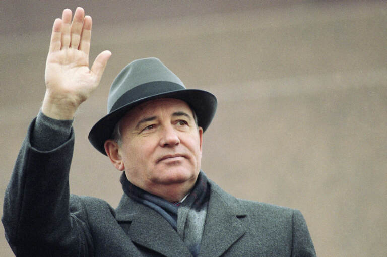 File photo: Soviet President Mikhail Gorbachev waves from the Red Square tribune during a Revolution Day celebration, in Moscow, Soviet Union, Tuesday, Nov. 7, 1989.  (AP Photo/Boris Yurchenko, File)