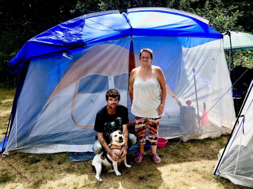 IMG_6685 Tony Morano, 38 (left), and Anne Douglass, 60, set up tents along the bike path in Norristown. (Courtesy of Mark Boorse)