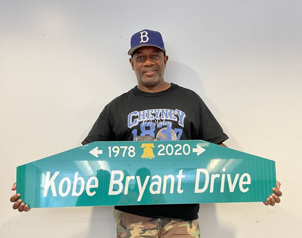 KobeBryandDr LeRoy McCarthy holds up a street sign for the proposed Kobe Bryant Drive. (Courtesy of LeRoy McCarthy)