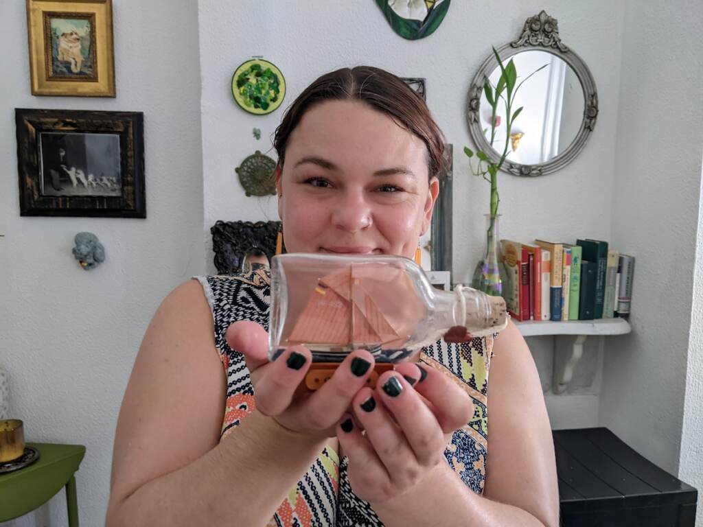 PXL_20220816_193807184 Tanya Mayeux, who manages the StoopingPHL Instagram account, says her favorite thing she's ever found is a small ship in a glass bottle. (Elizabeth Estrada/WHYY)