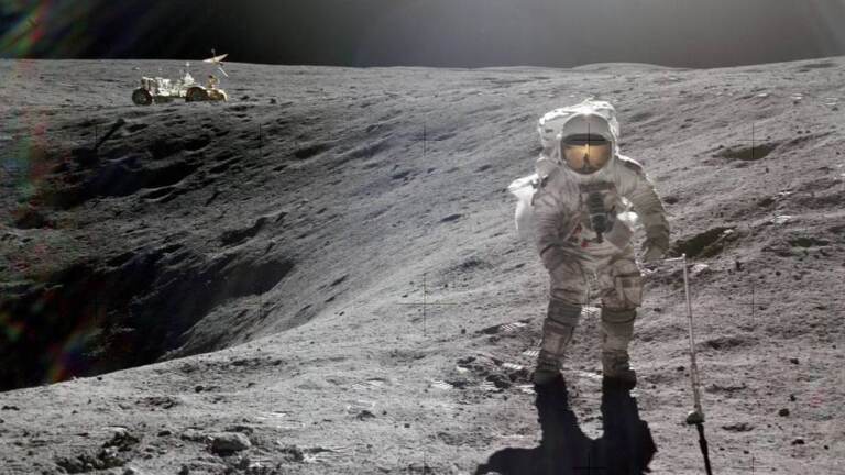 Astronaut Charlie M. Duke Jr., lunar module pilot of the Apollo 16 lunar landing mission, is photographed collecting lunar samples during the first Apollo 16 extravehicular activity at the Descartes landing site. (John W. Young/NASA)