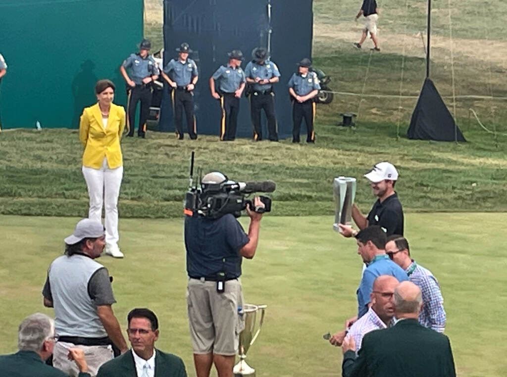 Winner Patrick Cantlay hoists the championship trophy at the BMW Championship at Wilmington Country Club
