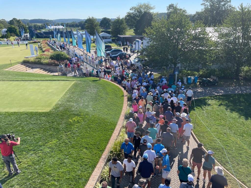 crowd stream in A parade of fans stream into Wilmington Country Club for the opening round.