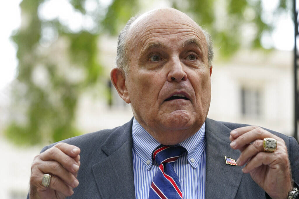Georgia Election Investigation A close-up of Rudy Giuliani speaking with his hands raised in front of him.