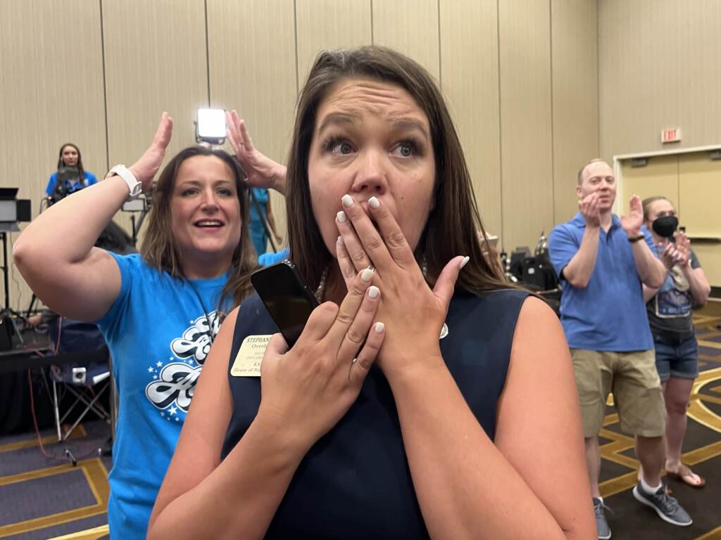Kansas state Rep. Stephanie Clayton reacts as a referendum to strip abortion rights out of the state constitution fails.