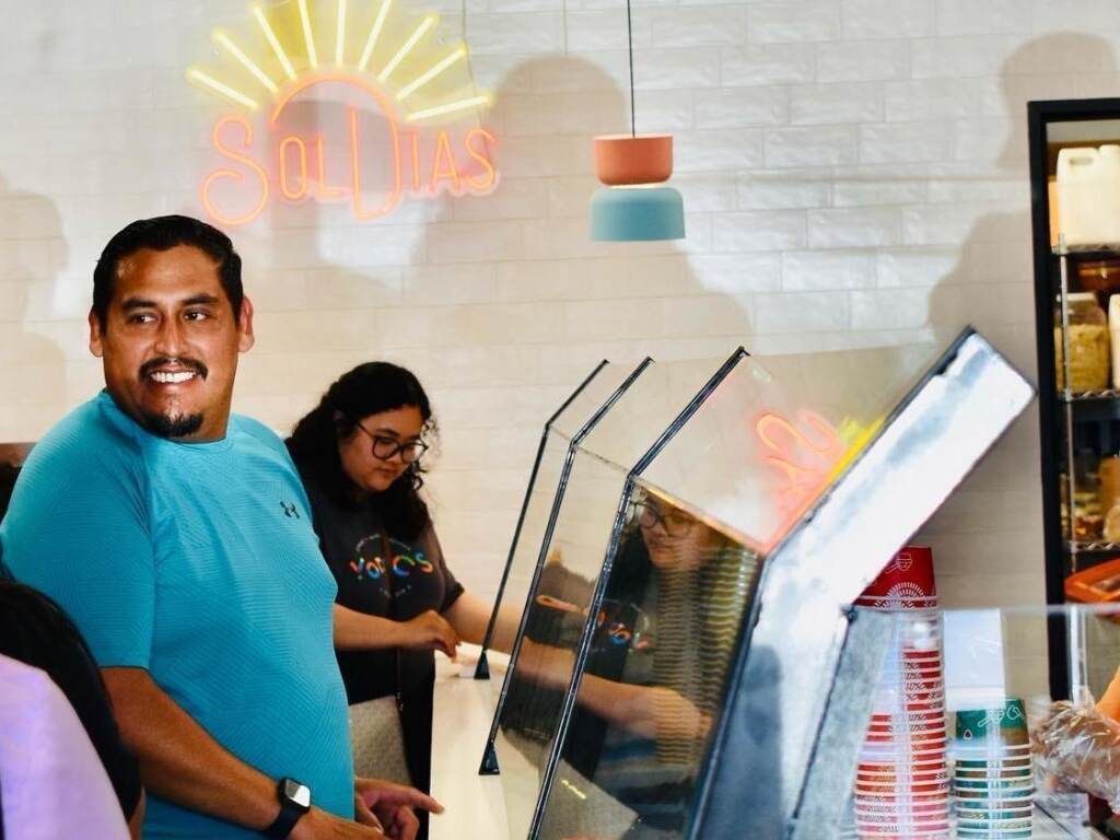 The SolDias ice cream stores in the Dallas-Fort Worth area noticed some customers were downsizing their orders this summer. The chain is exploring ways to cut costs to keep prices in reach. People smile in a store.
