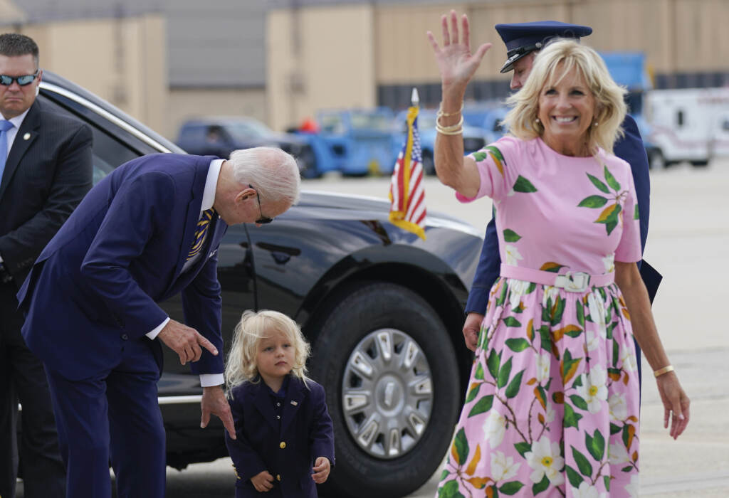 FILE - President Joe Biden looks at his grandson Beau Biden as first lady Jill Biden waves and walks to board Air Force One at Andrews Air Force Base, Md., Aug. 10, 2022. First lady Jill Biden tested positive for COVID-19 and is experiencing ‘mild symptoms’ the White House announced Tuesday. (AP Photo/Manuel Balce Ceneta, File)
