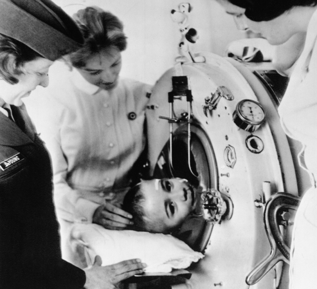 polio lead artt Johnny Whetzel says goodbye to his two University of Virginia Hospital nurses, Beverly Archer, center, and Peggy Moore, right, who cared for him during five months of treatment for polio in Charlottesville, Virginia (AP Photo)