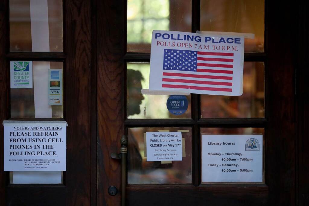 spotlight-voting-pennsylvania-1620×1080 A sign for a polling place is seen on the exterior of a door