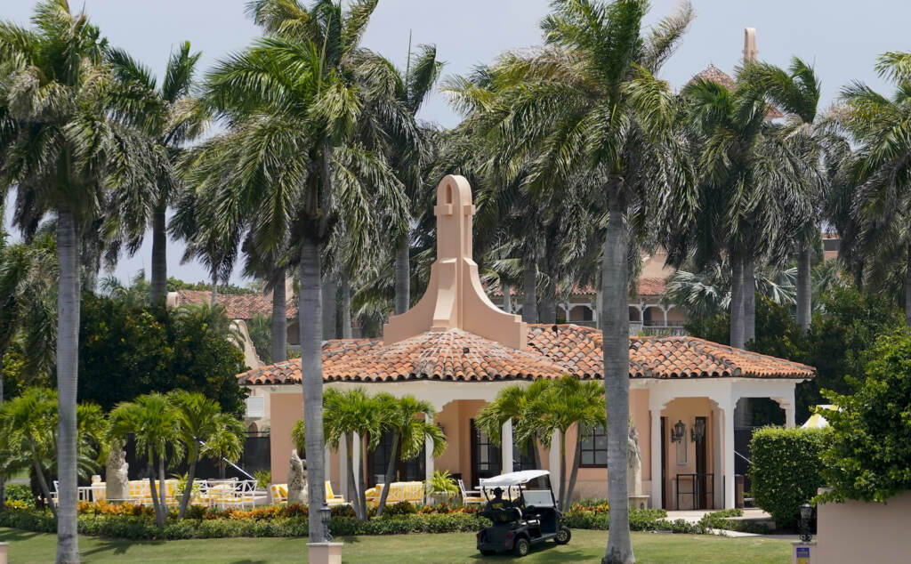 Security moves in a golf cart at former President Donald Trump's Mar-a-Lago estate