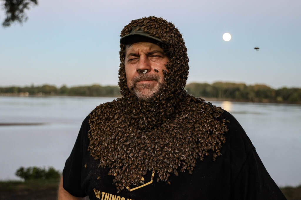 09 08 2022 k paynter bee beard don shump honey festival 3 Don Shump poses with his head, neck, and upper torso covered in honey bees at the Philadelphia Honey Festival. (Kimberly Paynter/WHYY)
